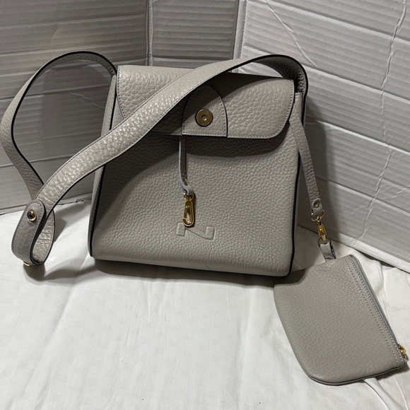 Nathan Baume cow pebble leather crossbody/shoulder bag with gold tone hardware.